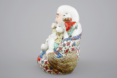 A Chinese famille rose Buddha Hotei with children, 19/20th C.