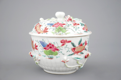 A Chinese famille rose and relief box and cover and two saucers with fish, Yongzheng, 1722-1735