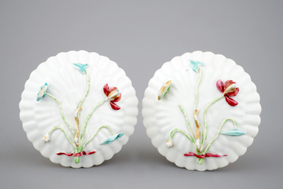 A Chinese famille rose and relief box and cover and two saucers with fish, Yongzheng, 1722-1735