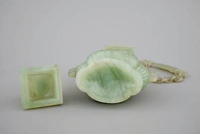 A Chinese carved green jadeite vase and cover on elaborate wooden stand, 19/20th C.