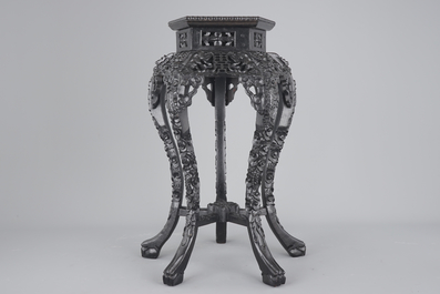An intricately carved Chinese hardwood marble top vase stand, 19th C.