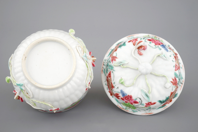 A Chinese famille rose and relief box and cover and two saucers with fish, Yongzheng, 1722-1735