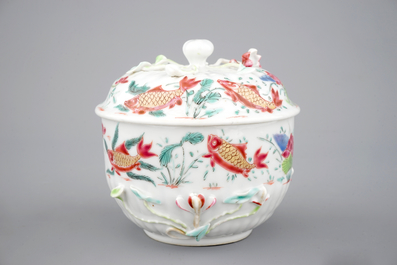 A Chinese famille rose and relief box and cover and two saucers with fish, Yongzheng, 1722-1735