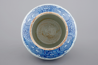 A tall blue and white Chinese porcelain landscape vase, early 18th C.