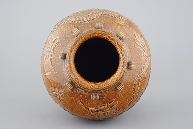 A large Martaban on a carved hardwood stand, 18/19th C.