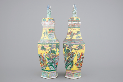 A pair of rare hexagonal Chinese famille jaune porcelain vases with figural covers, 19th C.