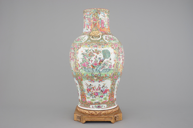 A tall Chinese Canton rose medallion porcelain vase on gilt wood stand, 19th C.