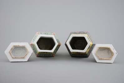 A pair of rare hexagonal Chinese famille jaune porcelain vases with figural covers, 19th C.