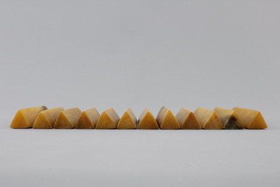 A set of 12 rare polished rhinoceros horn knife rests, ca. 1900