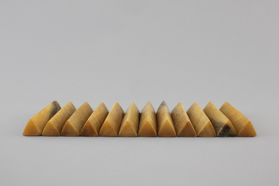 A set of 12 rare polished rhinoceros horn knife rests, ca. 1900
