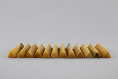 A set of 12 rare polished rhinoceros horn knife rests, ca. 1900