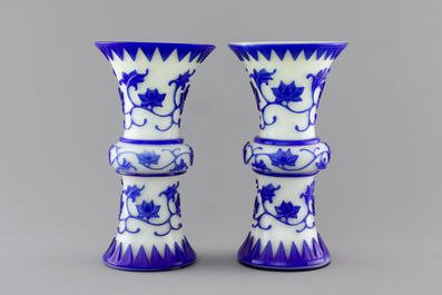 A pair of blue and white Chinese Peking overlay glass yenyen vases, early 20th C.