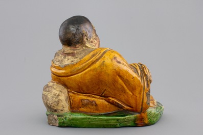 A Chinese sancai-glazed pottery Buddha, late Ming Dynasty