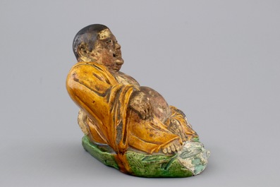 A Chinese sancai-glazed pottery Buddha, late Ming Dynasty