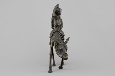 A Chinese bronze figure of a sage on a donkey, 18/19th C