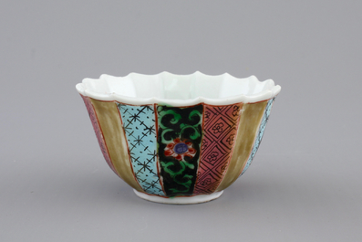 A Chinese famille rose porcelain cup and saucer with fishermen, Yongzheng, 1722-1735