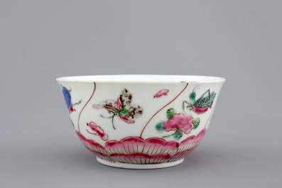 A Chinese porcelain famille rose cup and saucer with insects encircling a rose, Yongzheng-Qianlong, 18th C.
