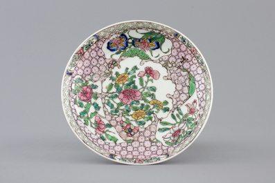 A Chinese famille rose porcelain cup and saucer with narcissus, chrysanthemum and peony, Yongzheng, 1722-1735
