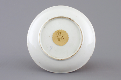 A Chinese famille rose porcelain cup and saucer with narcissus, chrysanthemum and peony, Yongzheng, 1722-1735