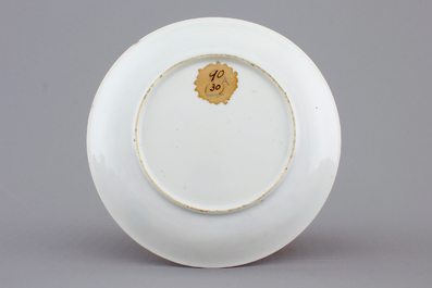 A Chinese porcelain famille rose cup and saucer with insects encircling a rose, Yongzheng-Qianlong, 18th C.