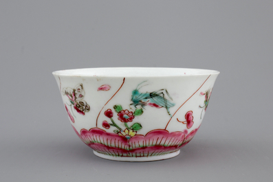 A Chinese porcelain famille rose cup and saucer with insects encircling a rose, Yongzheng-Qianlong, 18th C.