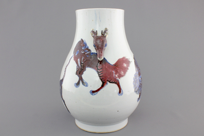 A Chinese hu-shaped deer-handled underglaze red and blue vase with finely painted animals, ca 1900