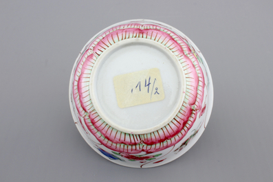A Chinese porcelain famille rose cup and saucer with insects encircling a rose, Yongzheng-Qianlong, 18th C.