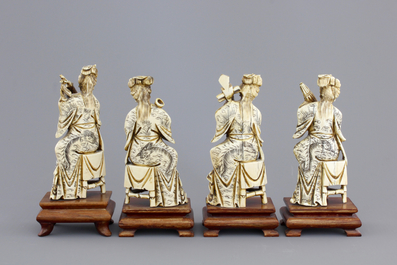 Four Chinese carved ivory ladies with instruments on wooden stands, ca. 1900