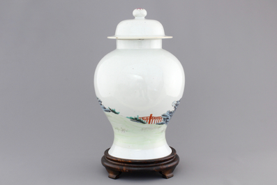 A Chinese famille rose porcelain vase with playing boys on a wooden stand, 19th C.