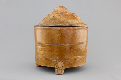 A brown-glazed pottery tripod vessel and mountain cover, Han Dynasty (206 BC-220 AC)