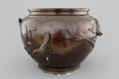 A Japanese bronze relief-decorated jardiniere, 19th C.
