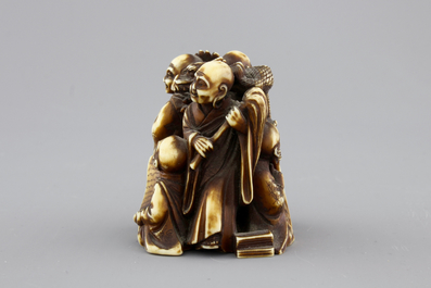 A Japanese patinated ivory netsuke: a dragon amongst sages, 19th C.