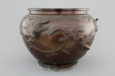 A Japanese bronze relief-decorated jardiniere, 19th C.
