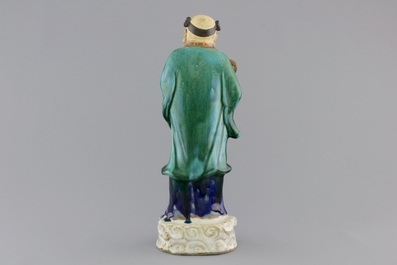 A Chinese sancai-glazed pottery figure, a famille rose teapot and a small ginger jar, 19th C.
