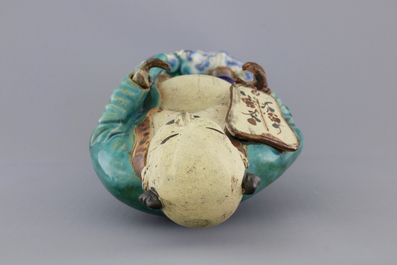 A Chinese sancai-glazed pottery figure, a famille rose teapot and a small ginger jar, 19th C.