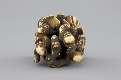 A Japanese patinated ivory netsuke: a dragon amongst sages, 19th C.