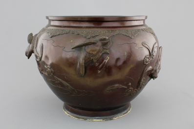 A Japanese bronze relief-decorated jardiniere, 19th C.