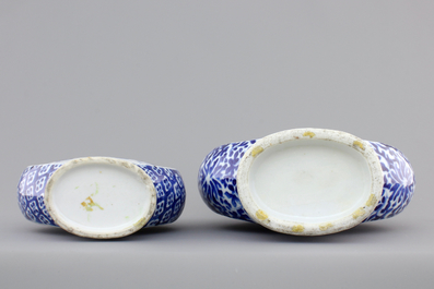 Two Chinese porcelain blue and white moon flasks, 19th C.