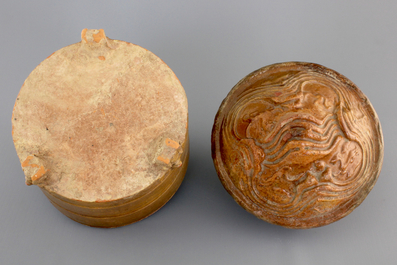 A brown-glazed pottery tripod vessel and mountain cover, Han Dynasty (206 BC-220 AC)