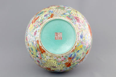A Chinese famille rose porcelain millefleurs bottle vase, 19th C.