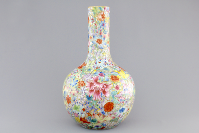 A Chinese famille rose porcelain millefleurs bottle vase, 19th C.