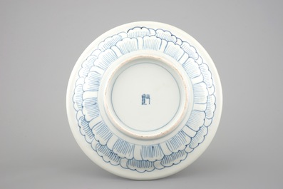 A Japanese Arita porcelain plate with relief-moulded decoration, 18th C.