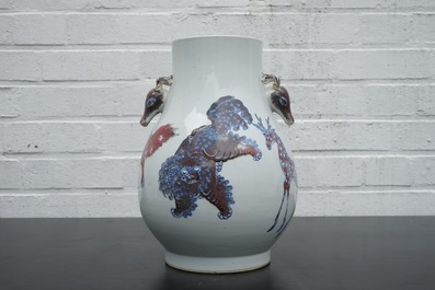 A Chinese hu-shaped deer-handled underglaze red and blue vase with finely painted animals, ca 1900
