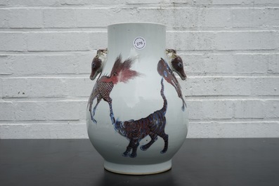 A Chinese hu-shaped deer-handled underglaze red and blue vase with finely painted animals, ca 1900