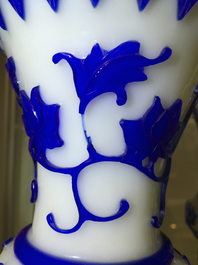 A pair of blue and white Chinese Peking overlay glass yenyen vases, early 20th C.