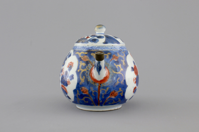 A set of three fine Chinese famille rose cups and two saucers, Yongzheng, and a Chinese Imari teapot, 18th C.