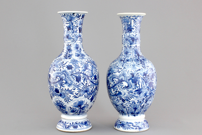 A pair of Chinese porcelain blue and white flower scroll vases, Kangxi, ca. 1700