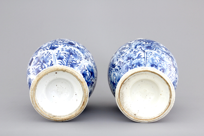 A pair of Chinese porcelain blue and white flower scroll vases, Kangxi, ca. 1700