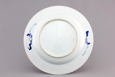 A Chinese blue and white porcelain landscape dish, 3 smaller plates and a saucer, Kangxi, ca. 1700