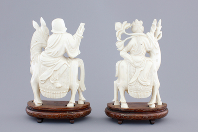 Two carved ivory figures of Chinese immortals on deers, ca. 1920